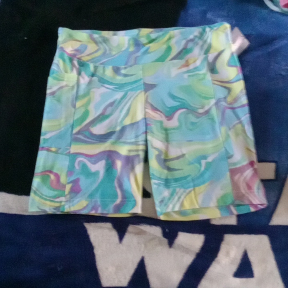 Multi colored athletic shorts w/ side cellphone pocket.